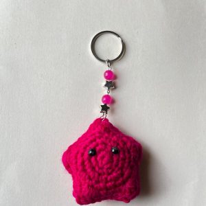Handmade crochet pink star keychain with decorative beads and metal ring by Veloura