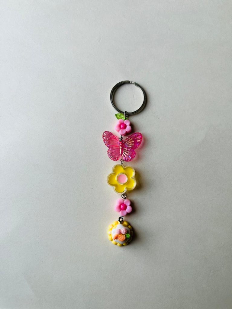 Handmade butterfly and flower keychain with colorful floral charms