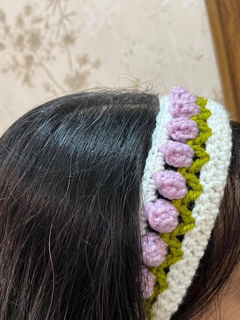 Handmade lavender crochet floral headband with green leaves by Veloura